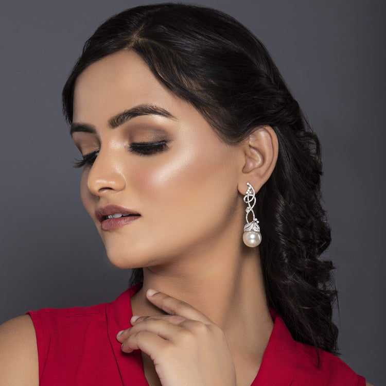 Golden flower pearl earrings at ₹1450 | Azilaa